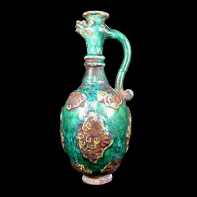 Tang Dynasty ewer with phoenix head and molded decorations