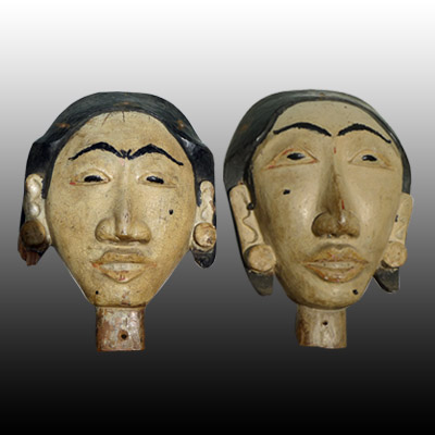 Bali male and female anamist head carvings