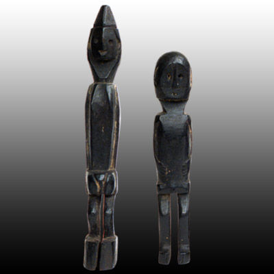 Two Dayak wooden charms