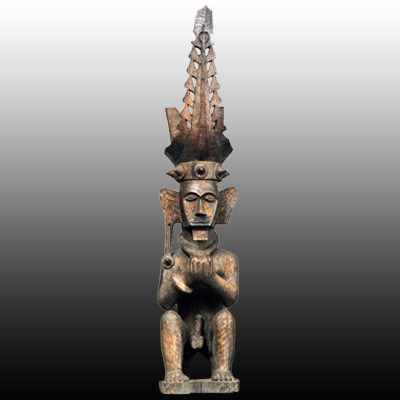 Nias Island male ancestor figure seated and holding a cup in both hands