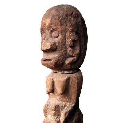 Batak Toba stone female fertility figure clutching a newly born child between her legs