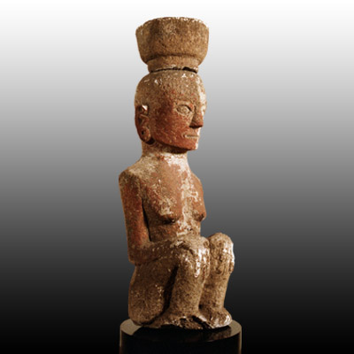 Batak Toba stone femal figure in seated position