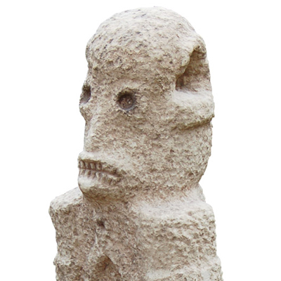 Megalithic Sumba Island stone grave effigy or Penji with horrific skeletal gaze