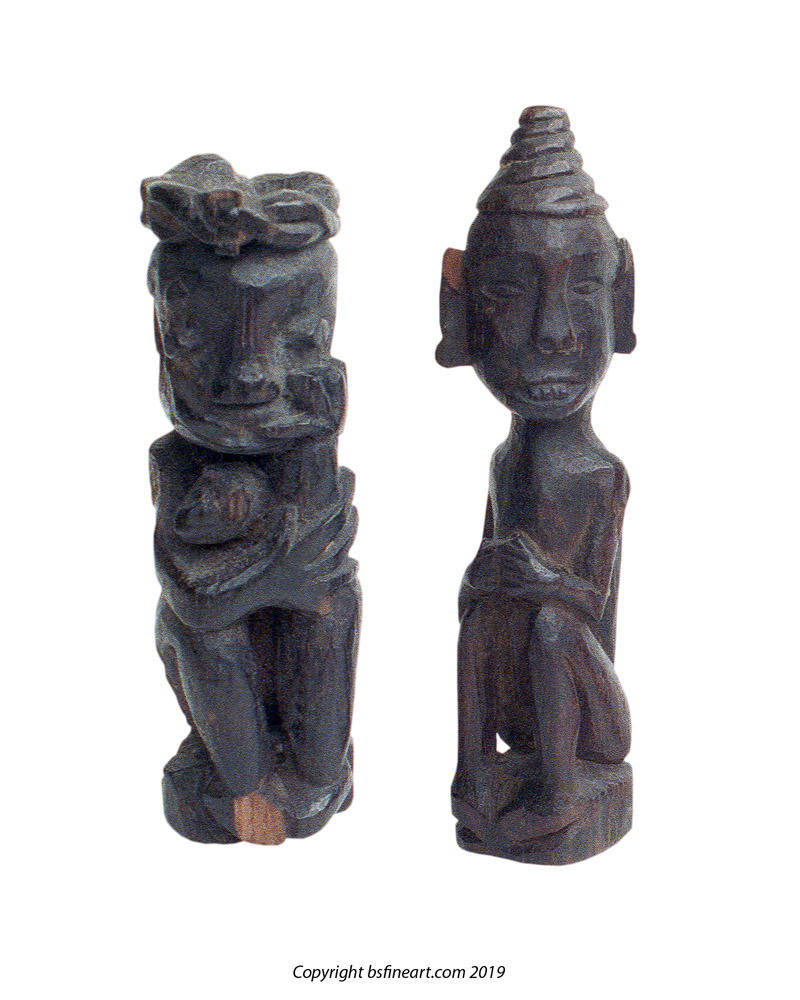 Two Dayak wooden charms