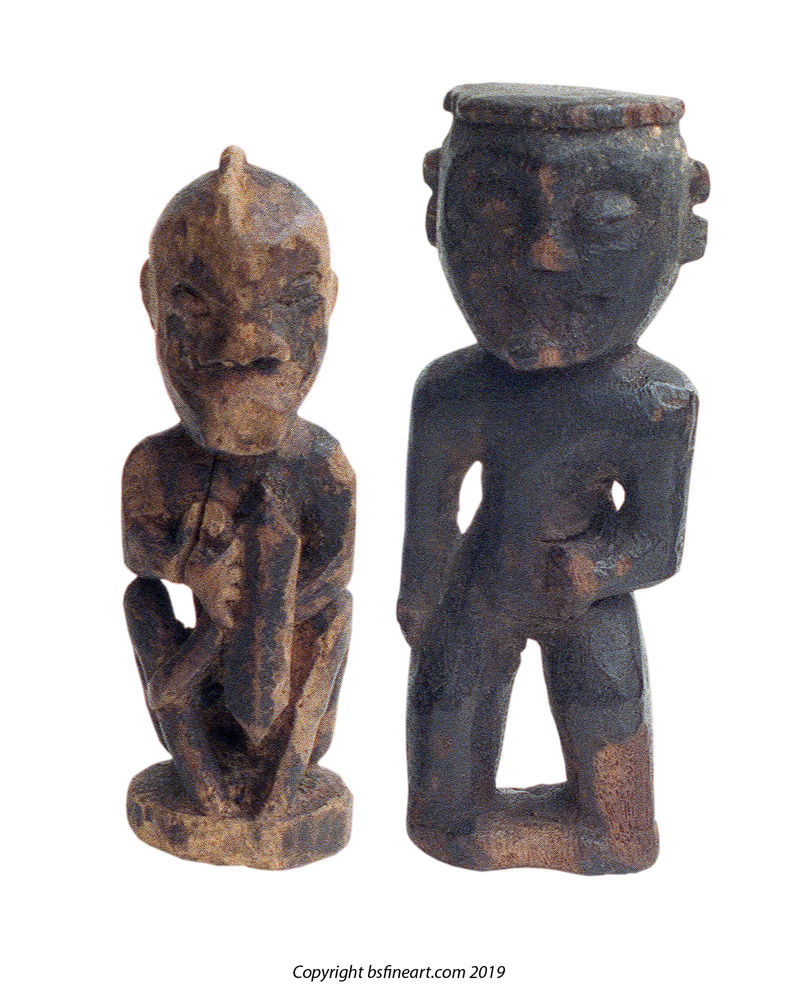 Two Dayak wooden charms