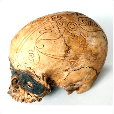 Dayak human trophy skull with finely carved cranial area and eyes set with pitch