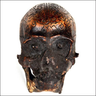 Dayak human trophy skull with carved cranium and eyes set with pitch