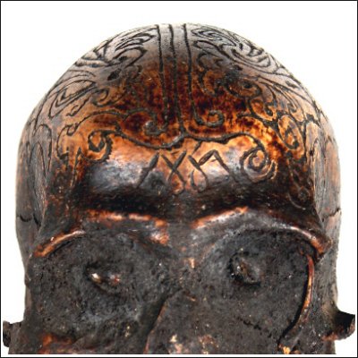 Dayak human trophy skull with carved cranium and eyes set with pitch