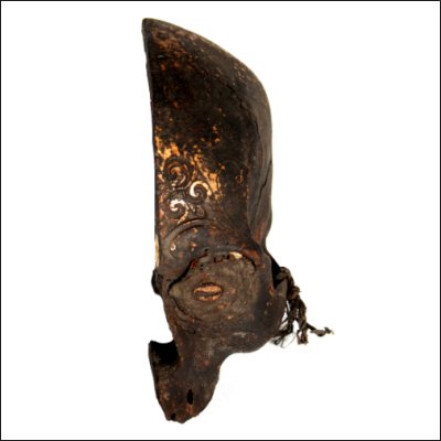 Dayak human trophy half skull with carved cranium and eyes set with pitch