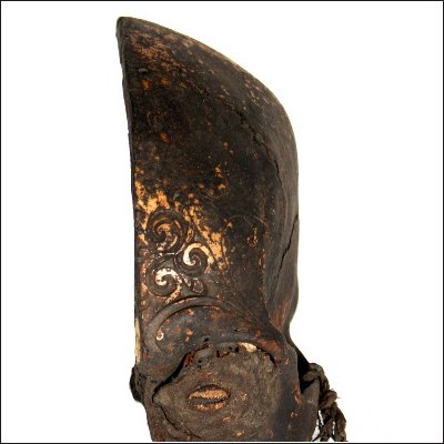 Dayak human trophy half skull with carved cranium and eyes set with pitch